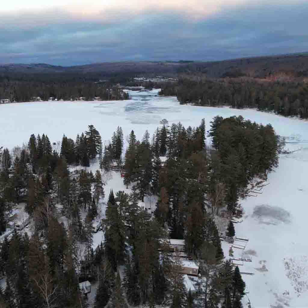 drone view of frozen Benior Lake in Harcourt