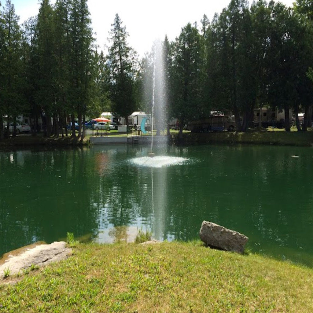 The swimming pond and fountain at Harmony Resorts - Ottawa East in Alfred Ontario.